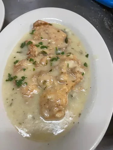 Chicken in a light cream sauce, garnished with parsley